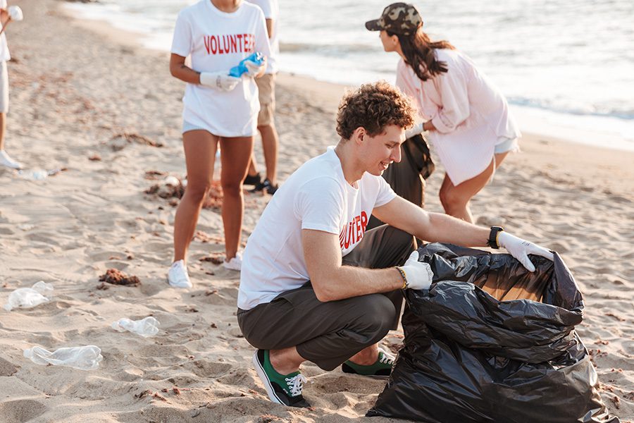 Specialized Business Insurance - A Group of Teenage Volunteers Cleaning a Beach From Plastic With Trash Bags